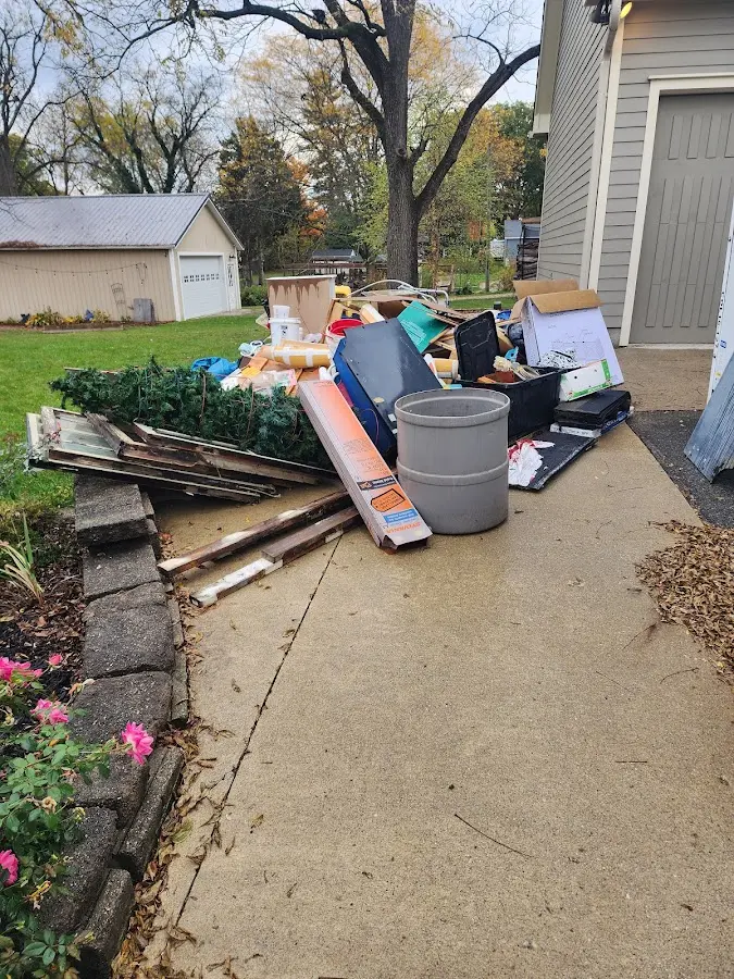 Dumpster being loaded with debris for 30 Yard Dumpster Rental in Waterbury